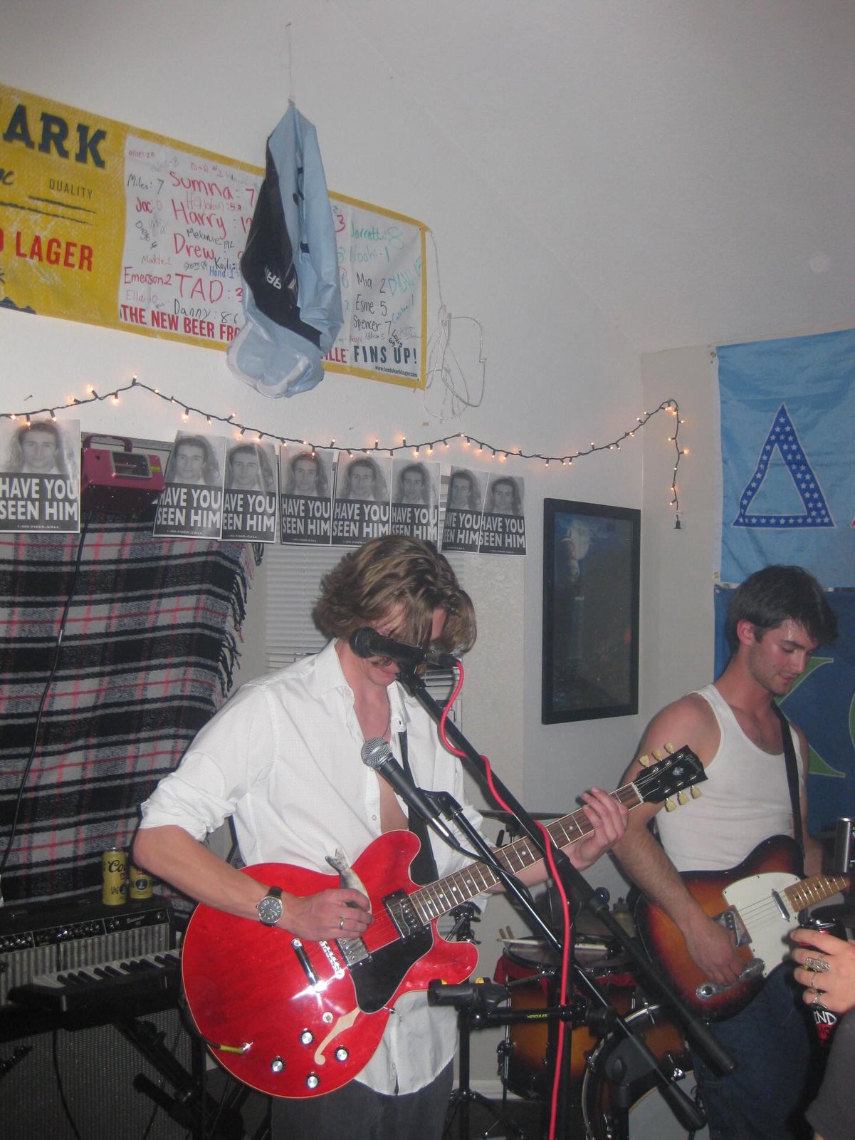 Flash snapshot from a house show, crowd pressed to the front