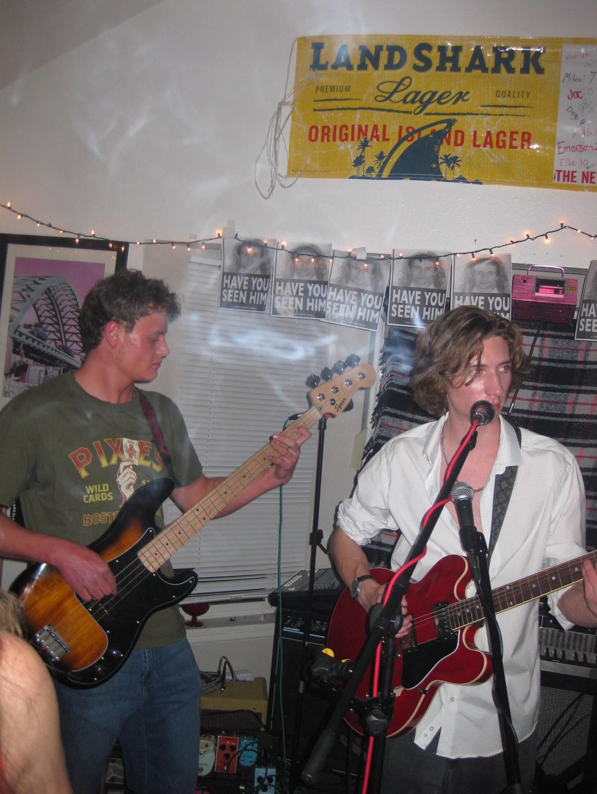 Flash snapshot from a house show, guitars at the front of the stage